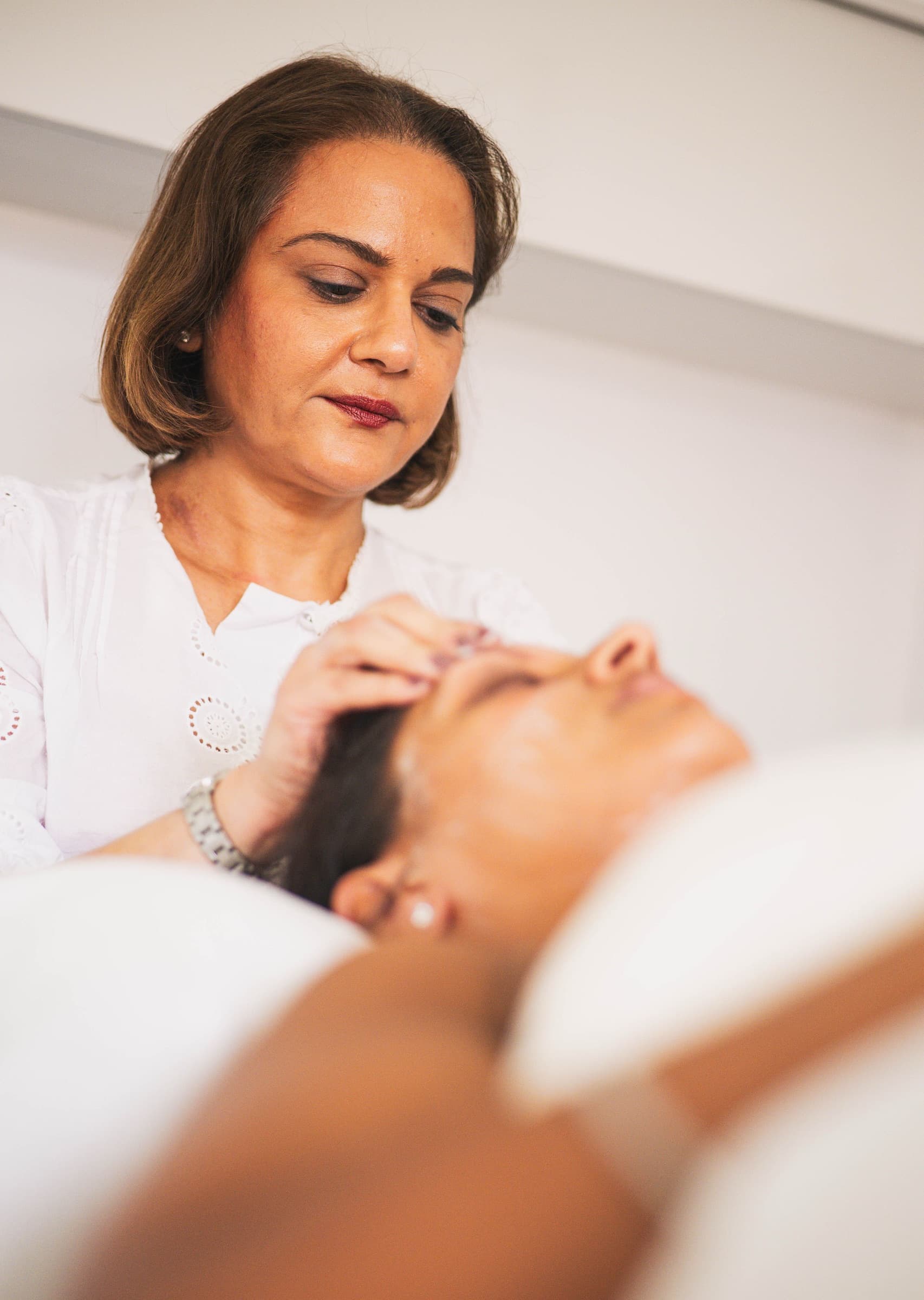 Alia performing a calming facial treatment at Relax Revive Beauty